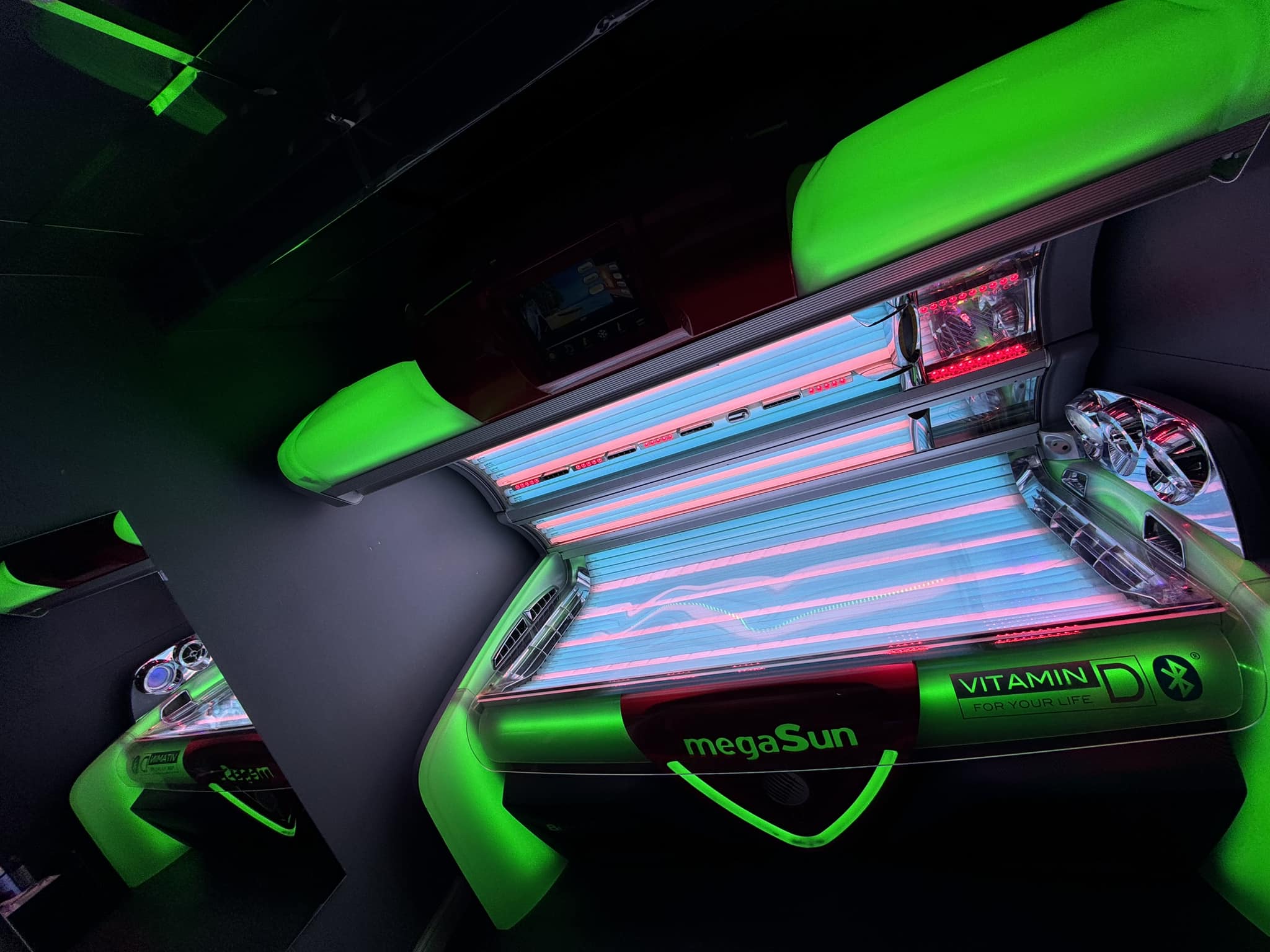 megaSun 8000 series bed with green neon accents in salon